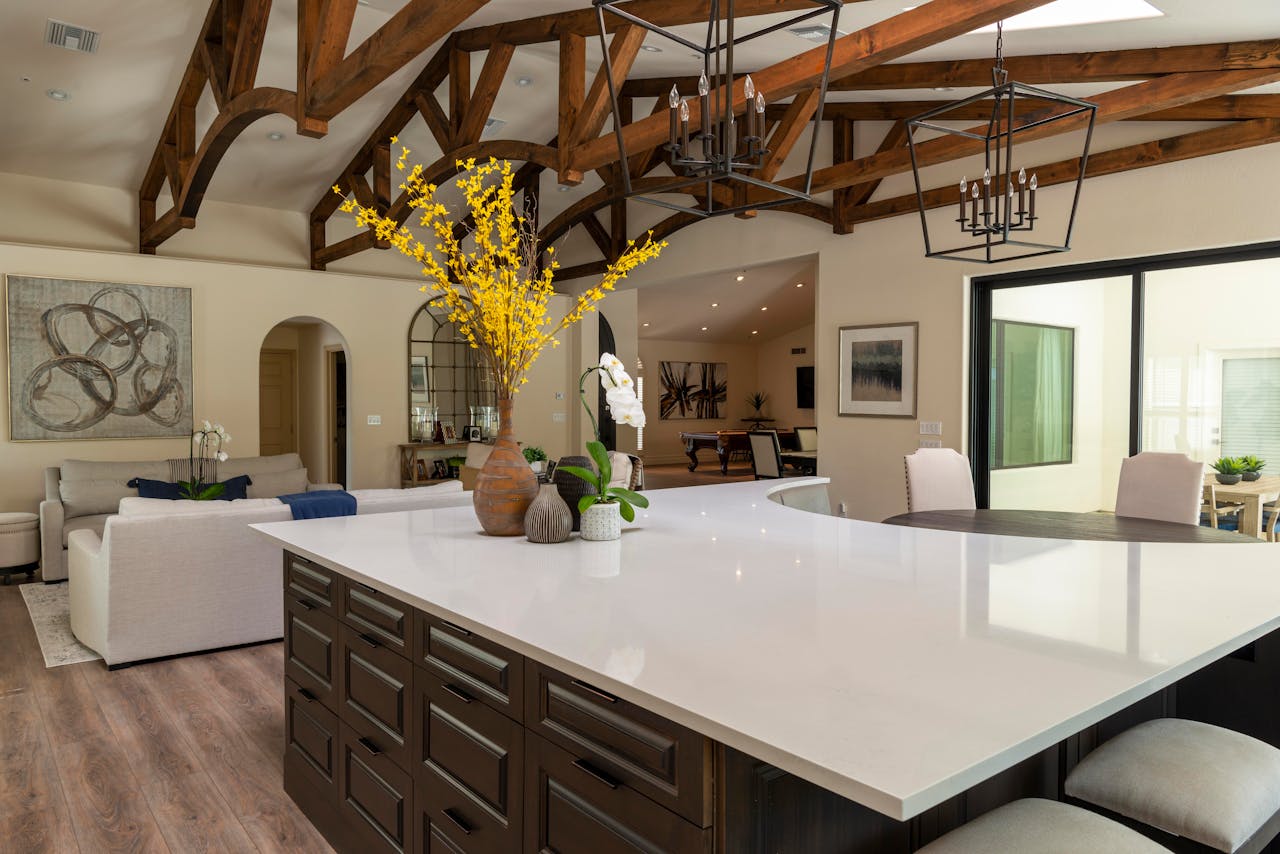 about-02 Spacious modern kitchen with elegant design and wooden vaulted ceiling.