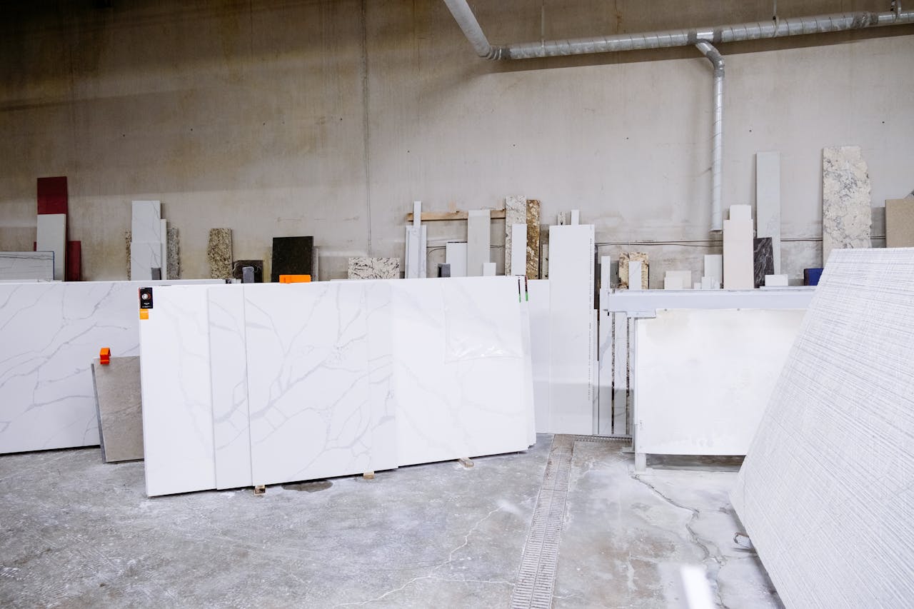 ours-journey Granite and stone slabs in a manufacturing facility showing industrial processes.